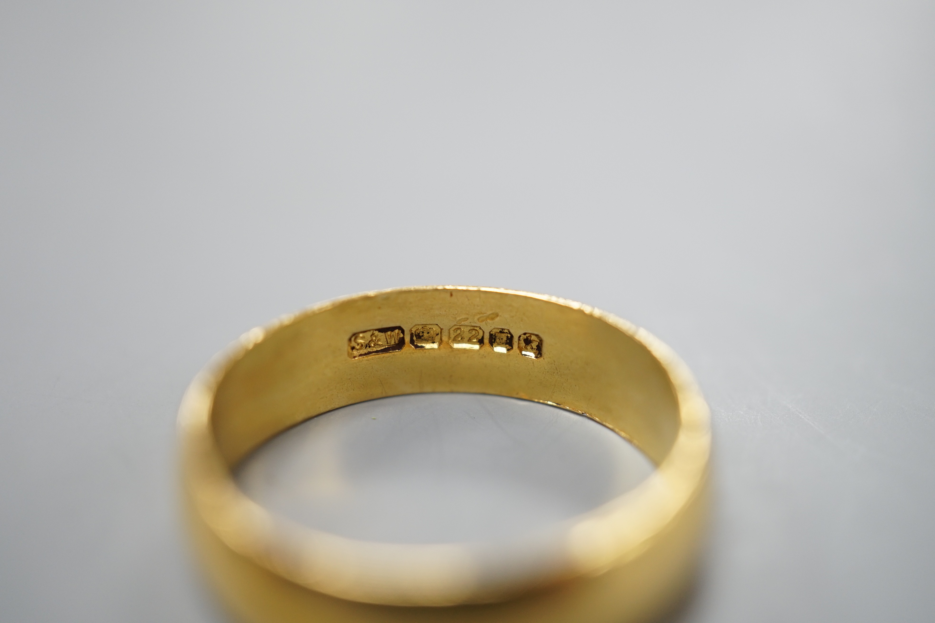 A 1960's 22ct gold wedding band, size R/S, 5.7 grams.